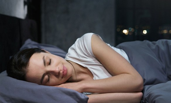 Woman sleeping peacefully after sleep apnea treatment in Eugene