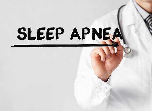 Sleep apnea doctor using marker to underline the words sleep apnea