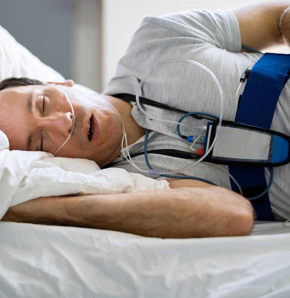 Man undergoing sleep test for sleep apnea diagnosis