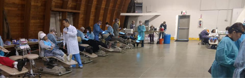 Patients receiving dental exams during community event