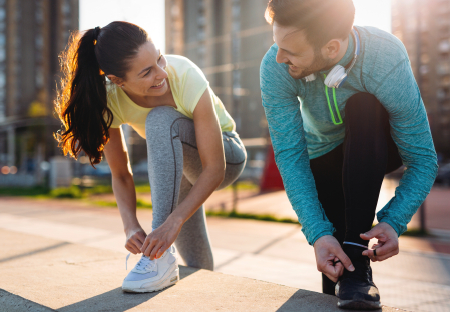 Man and woman getting ready to go for a run