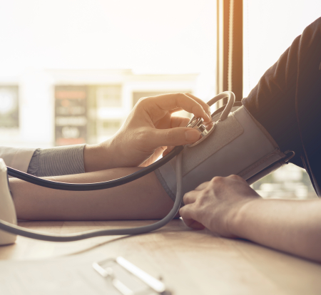 Person in blood pressure cuff