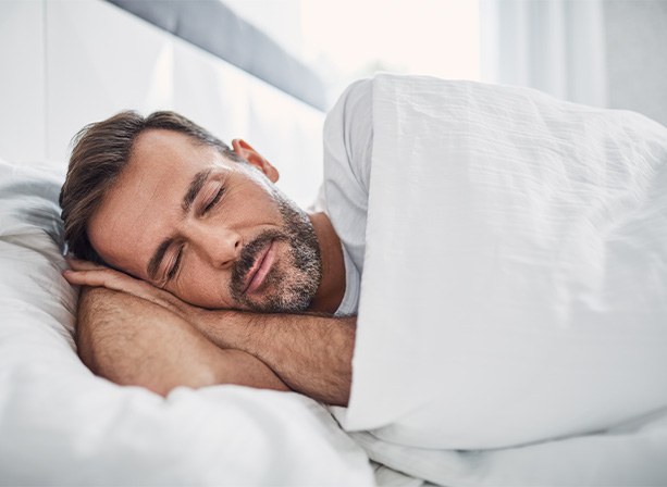Man sleeping peacefully on his side