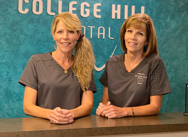 Two team members smiling