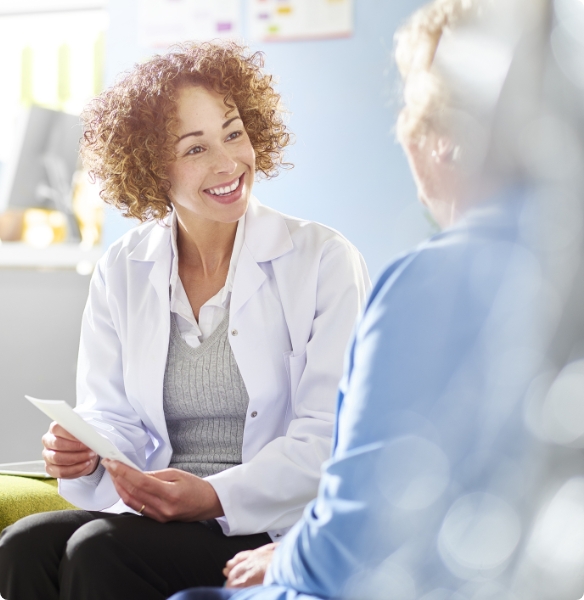 Sleep apnea dental team member showing patient insurance forms