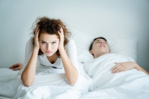 Man snoring because of sleep apnea in Eugene, wife is frustrated