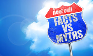 Blue street sign with words facts vs myths