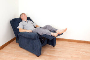 Man sleeping in a recliner chair